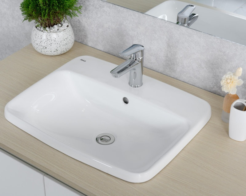 Mẫu chậu lavabo dương vành INAX, hay còn gọi là lavabo bán âm bàn, lavabo âm bàn dương vành INAX.